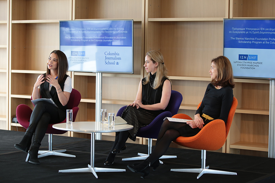 Close-up photo of three women sitting on the stage in the form of a panel, one of whom is talking and using her hands and the others are watching her