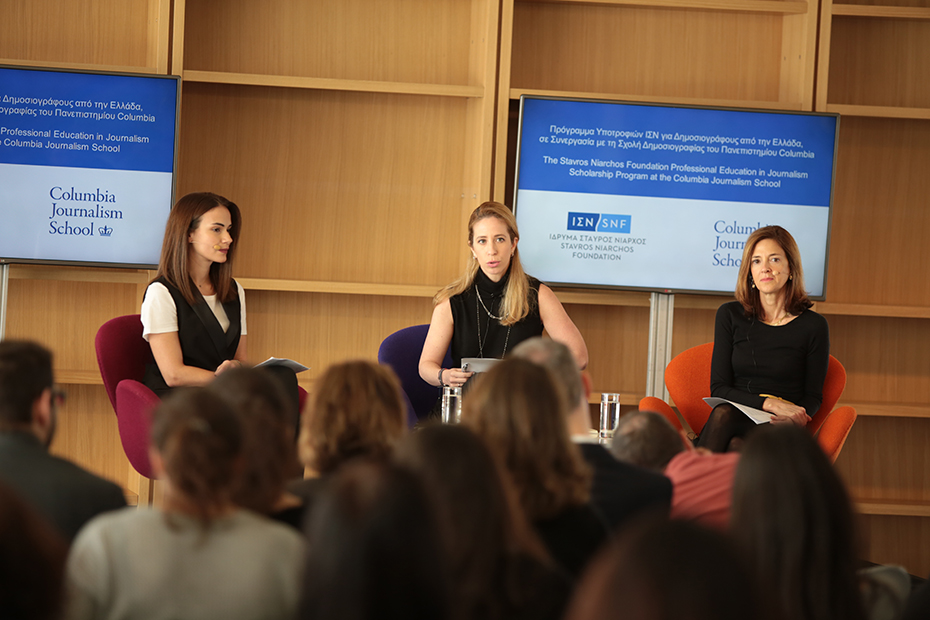 Three women sit on stage in the form of panels and communicate with the audience watching them