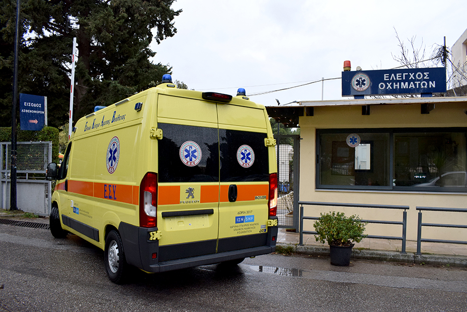 An ambulance drives out of a space for vehicle checks