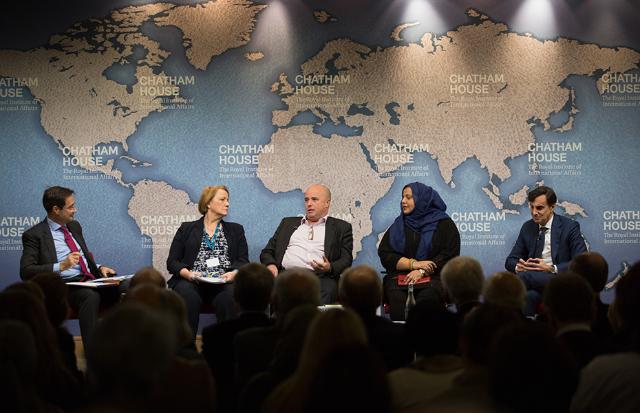 Andreas Dracopoulos, co-president of the Stavros Niarchos Foundation, talks on stage with fellow panel participants at Chatham House