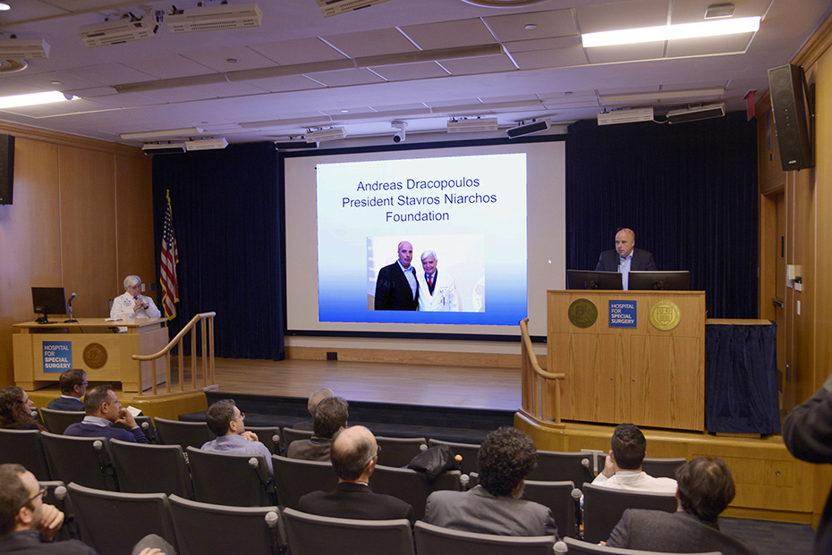 Andreas Dracopoulos, co-president of the Stavros Niarchos Foundation, gives a speech on a podium at the Hospital for Special Surgery