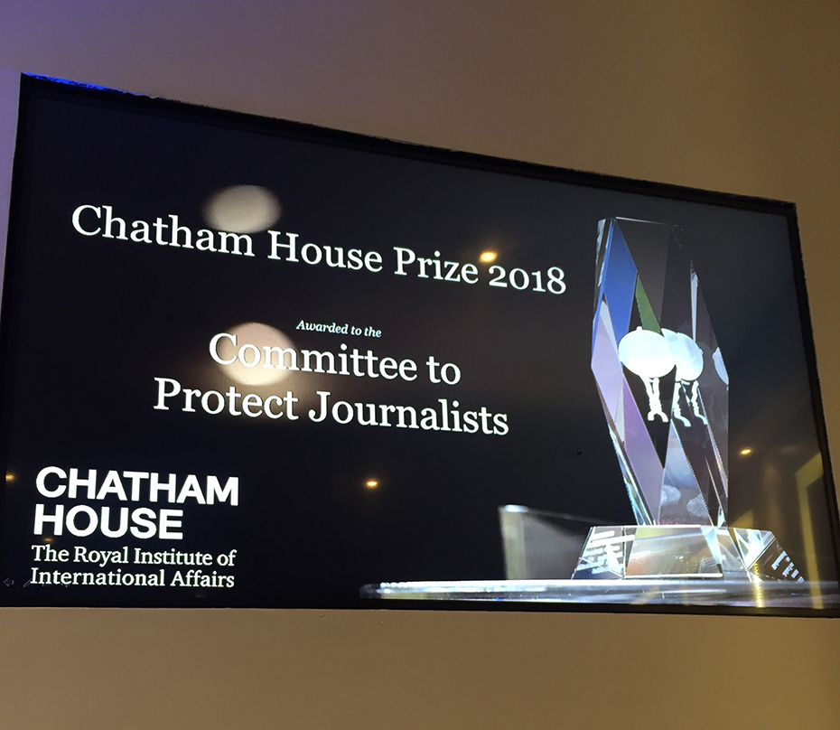A photo showing a screen displaying Chatman House Prize 2018 awarded to the Committee to Protect Journalists