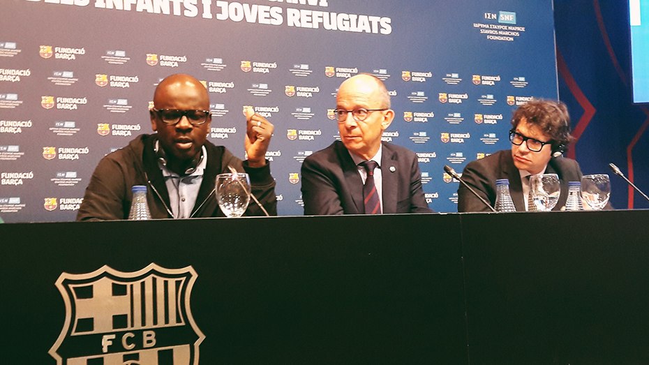 Three members of the Stavros Niarchos Foundation and the Barça Foundation at a media conference room