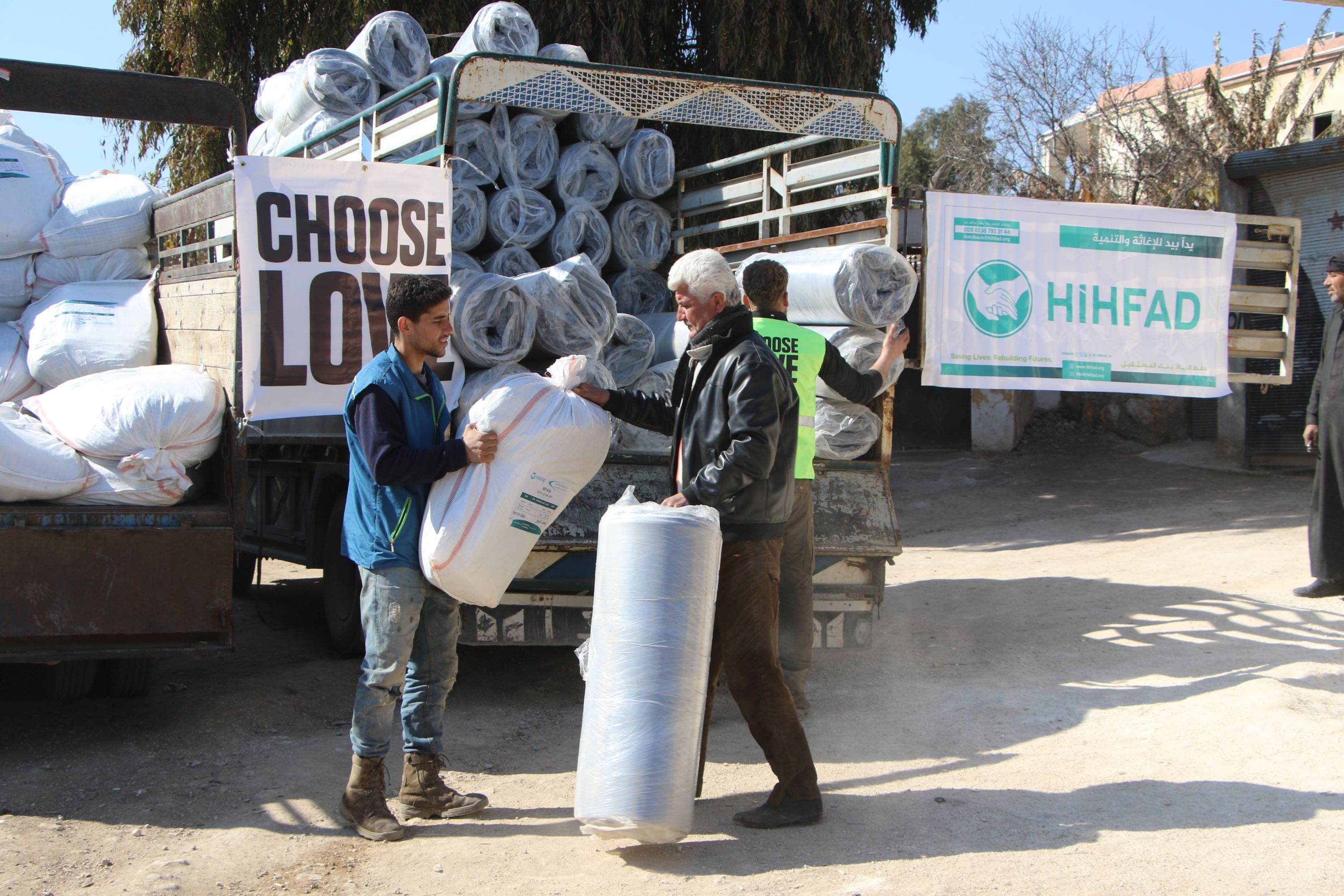 Unloading supplies from a truck that reads