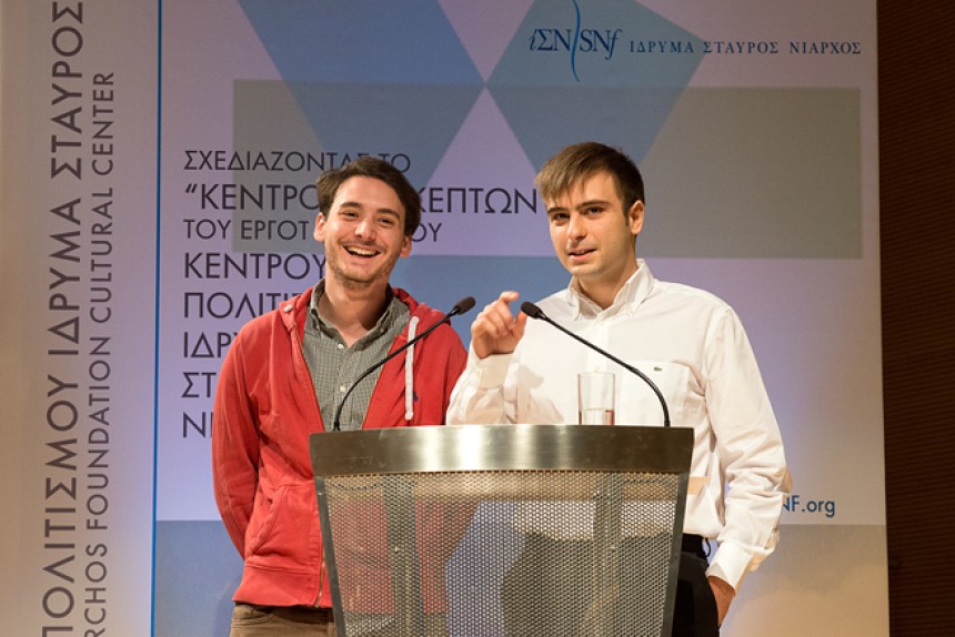 The two young men who were selected as the winners speak on stage at the Stavros Niarchos Foundation Cultural Center