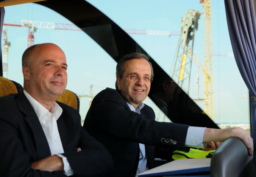 Antonis Samaras, the Prime Minister of the Hellenic Republic, and Andreas Dracopoulos, the co-president of the Stavros Niarchos Foundation, sit in a bus at the construction site of the Stavros Niarchos Foundation Cultural Center