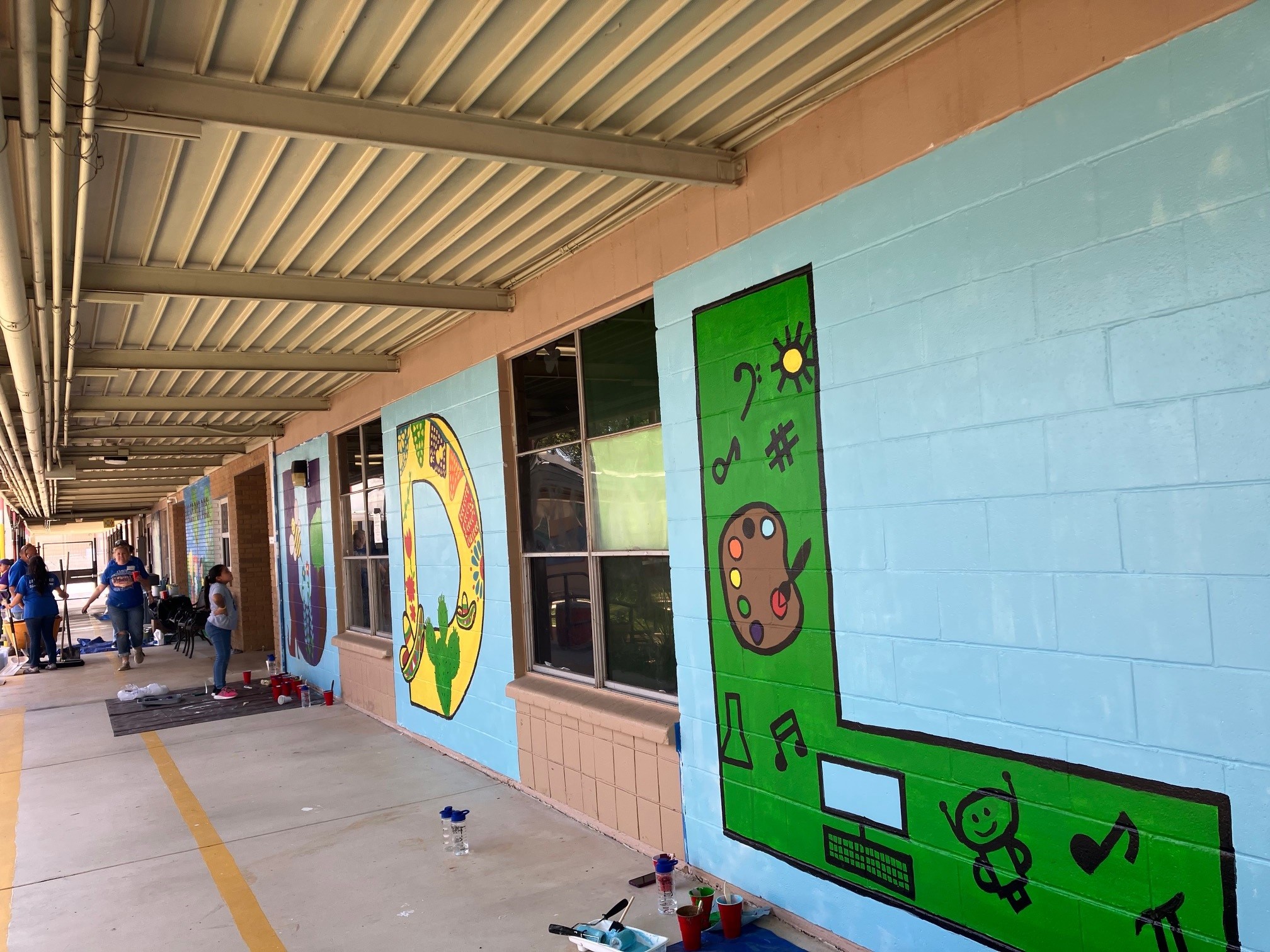 A colorful mural on a building's exterior.