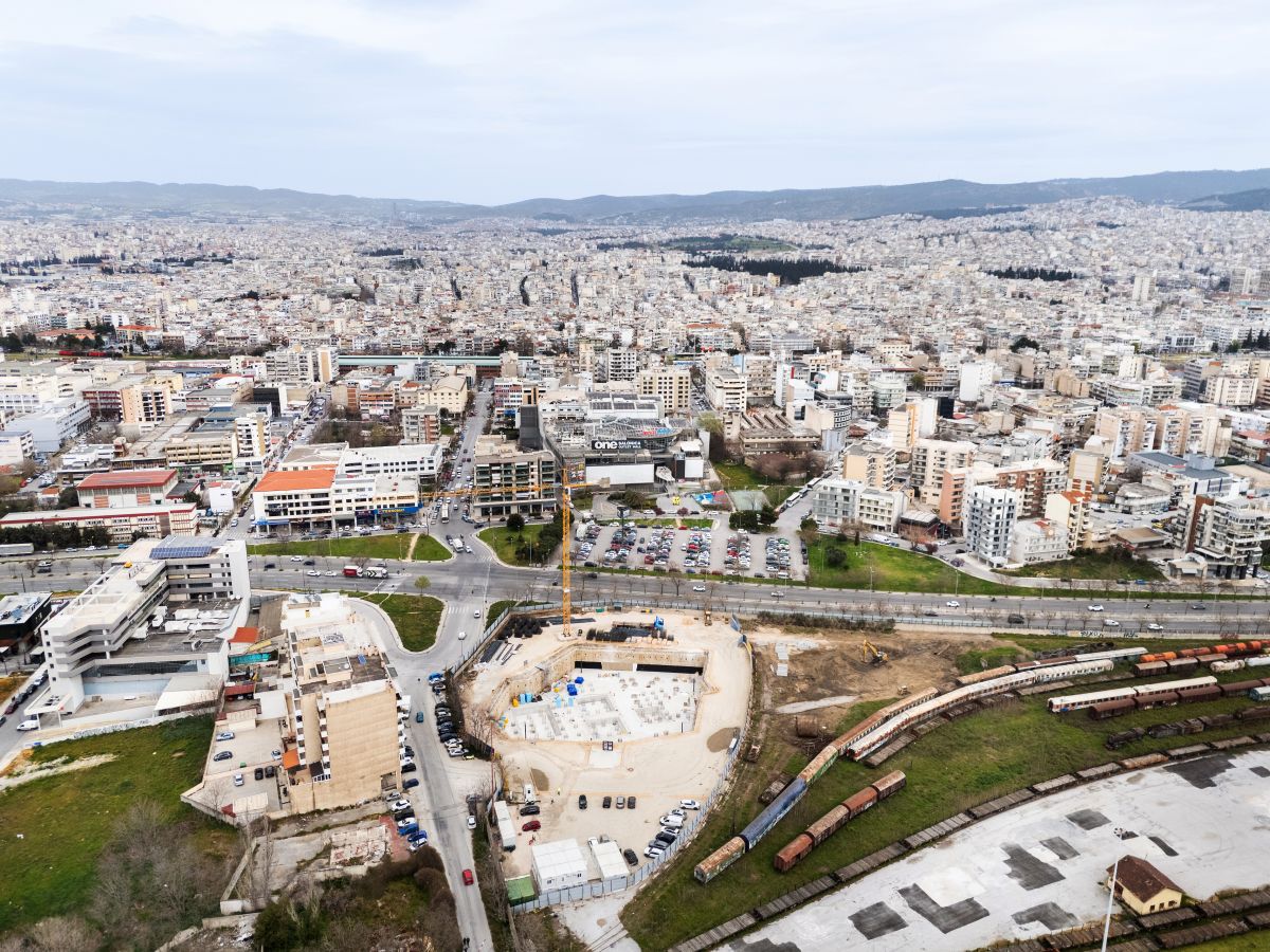 Aerial view of Holocaust Museum construction site in an urban neighborhood with roads in Thessalonki