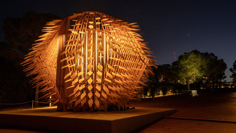 A large outdoors sculpture next to a pathway at the Stavros Niarchos Foundation Cultural Center