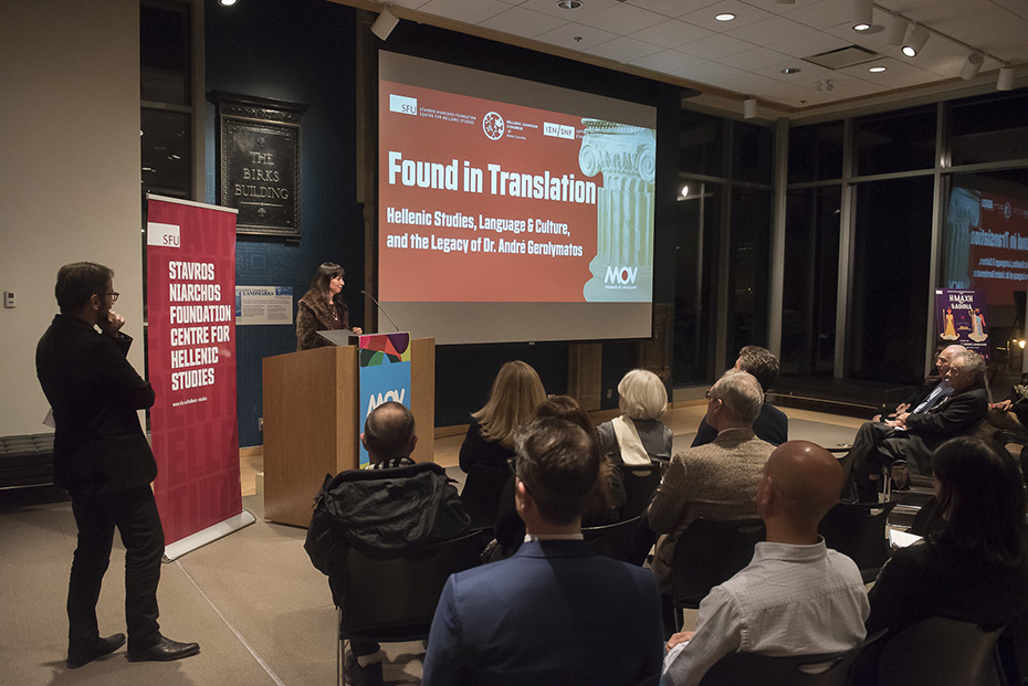 A woman gives a presentation titled