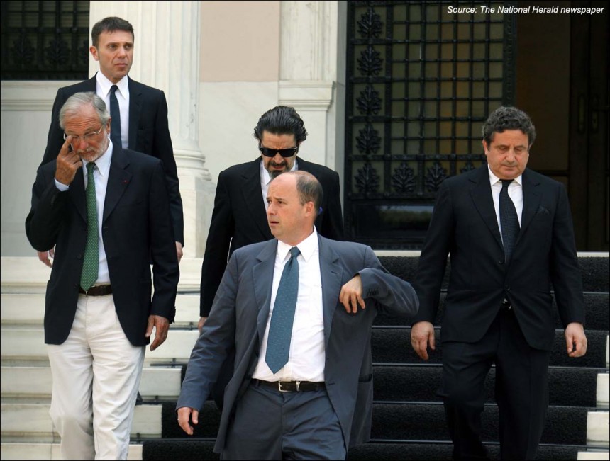 Andreas Dracopoulos, President of the Stavros Niarchos Foundation, walks down the steps with four other men