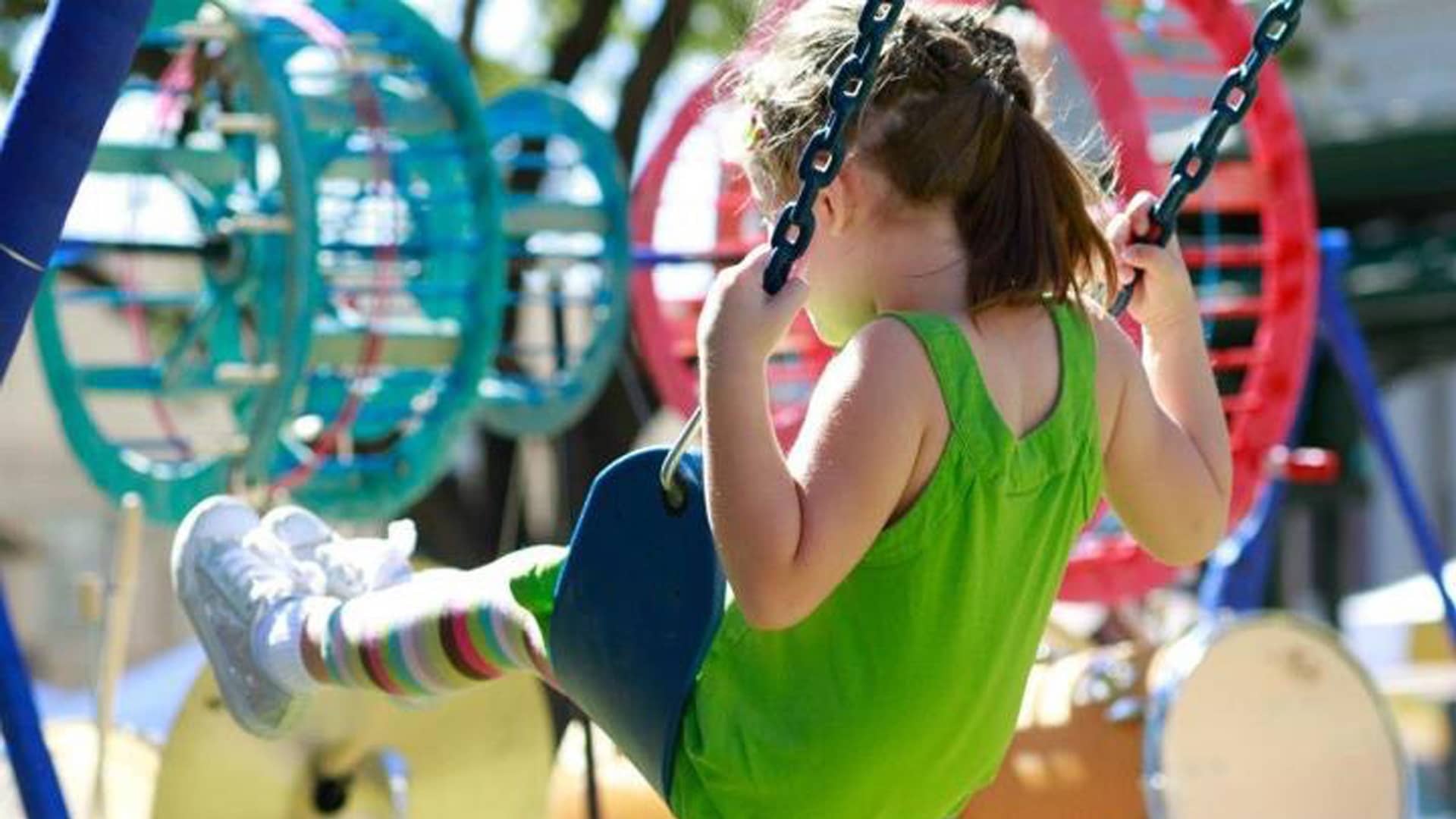 Photo of a little girl on a swing