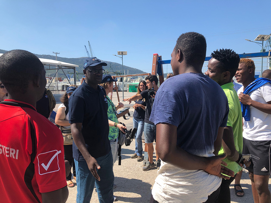 Men talking to each other in a public playground among the people