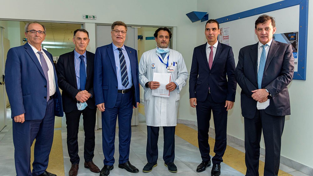 Six male representatives of Regeneration and Progress and the Stavros Niarchos Foundation stand for a photo