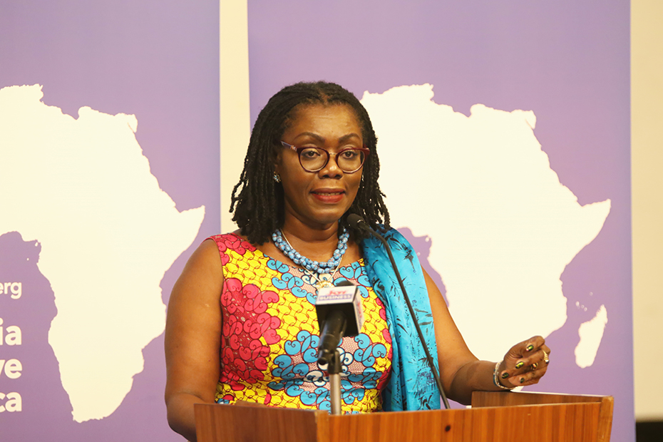 A woman makes a speech on the podium